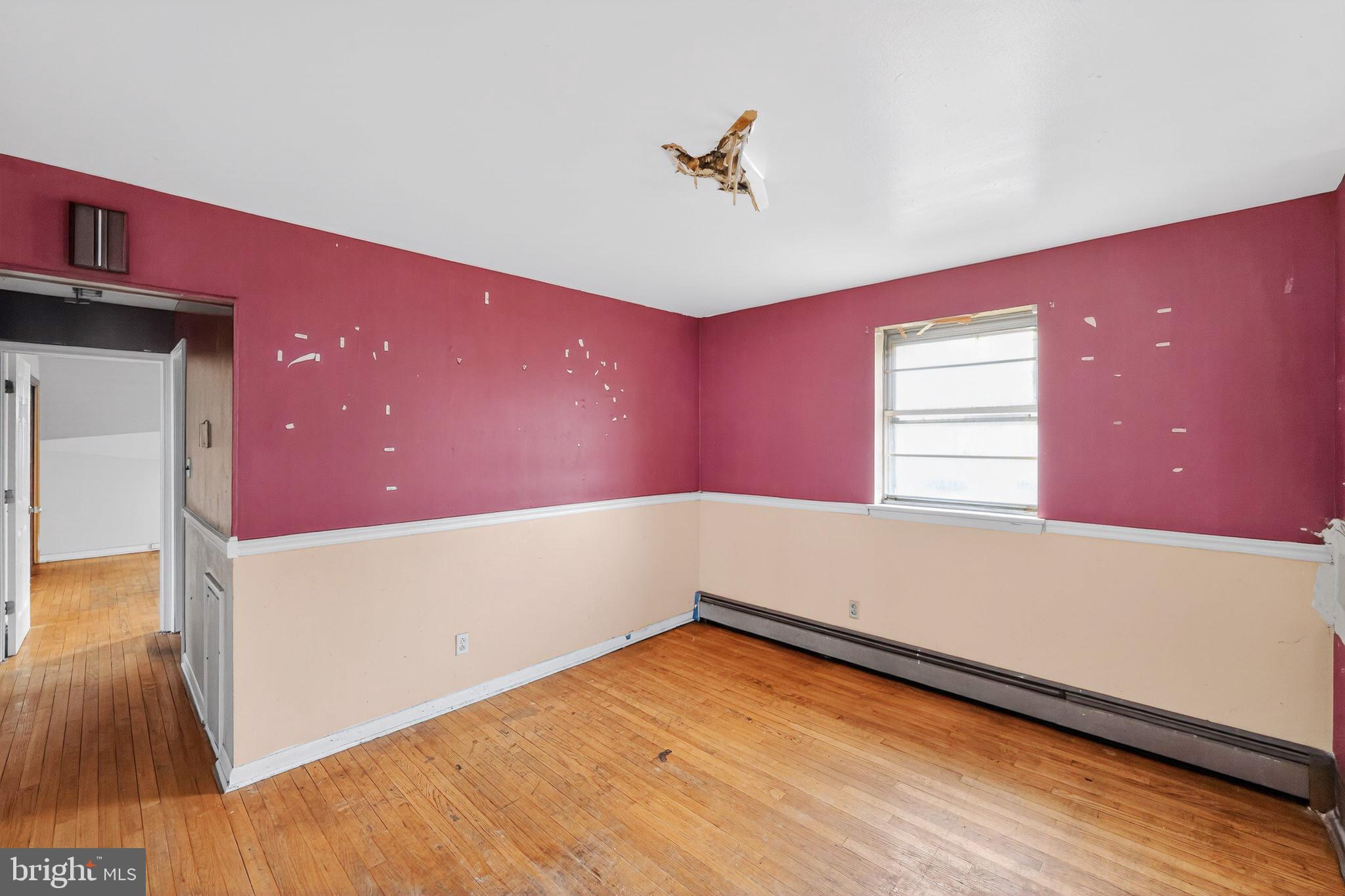 9300 Allentown Road Fort Washington, MD 20744 - Photo 13 of 33 a view of empty room with wooden floor and fan