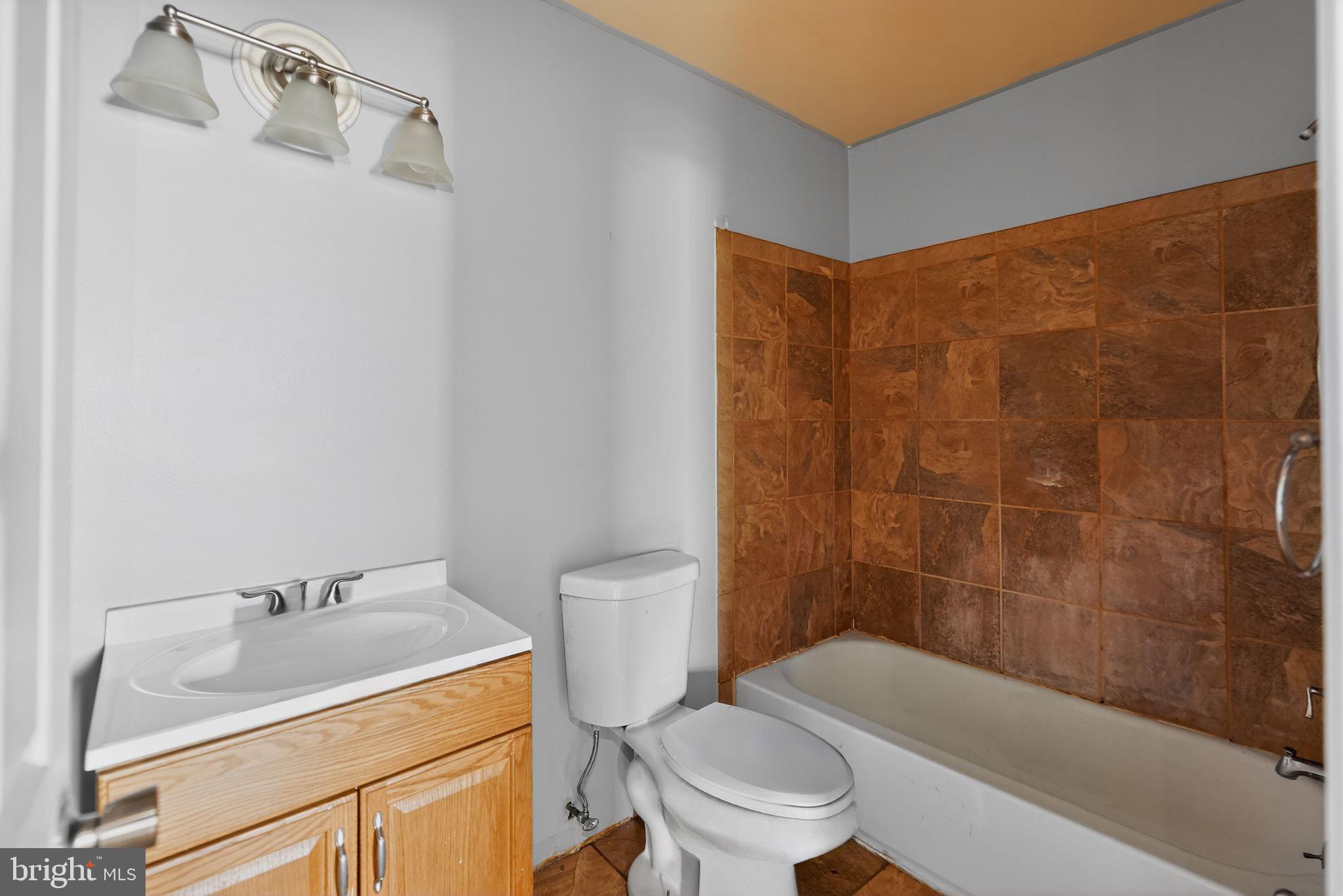 9300 Allentown Road Fort Washington, MD 20744 - Photo 15 of 33 a bathroom with a sink toilet and shower