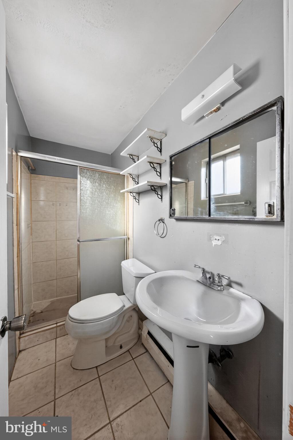 9300 Allentown Road Fort Washington, MD 20744 - Photo 17 of 33 a bathroom with a sink toilet and shower