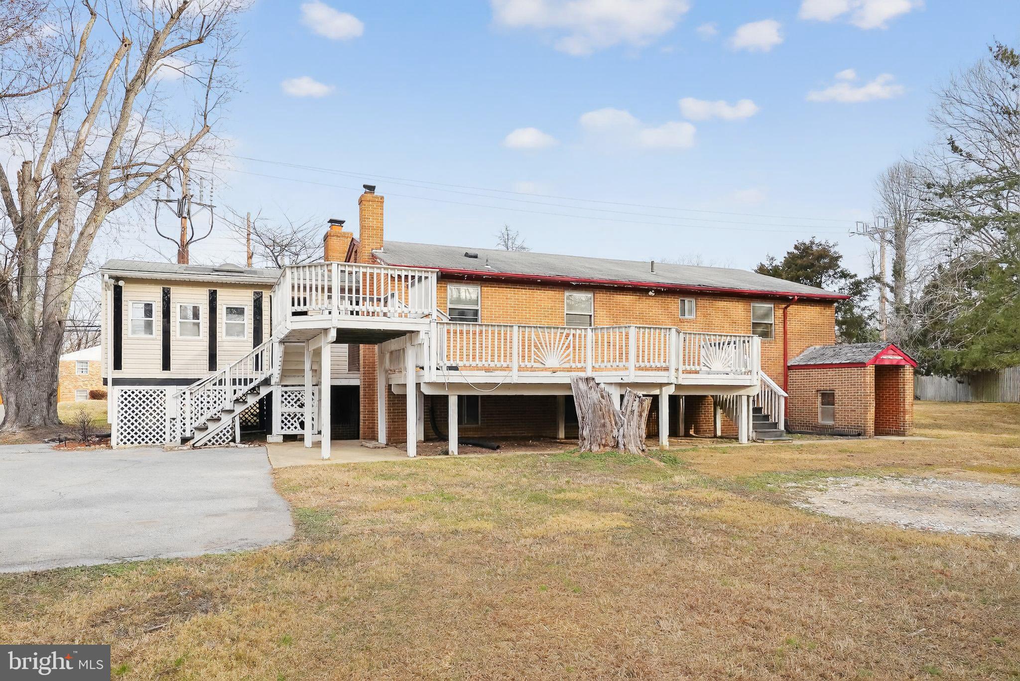 9300 Allentown Road Fort Washington, MD 20744 - Photo 24 of 33 a view of a house with a large tree and wooden fence