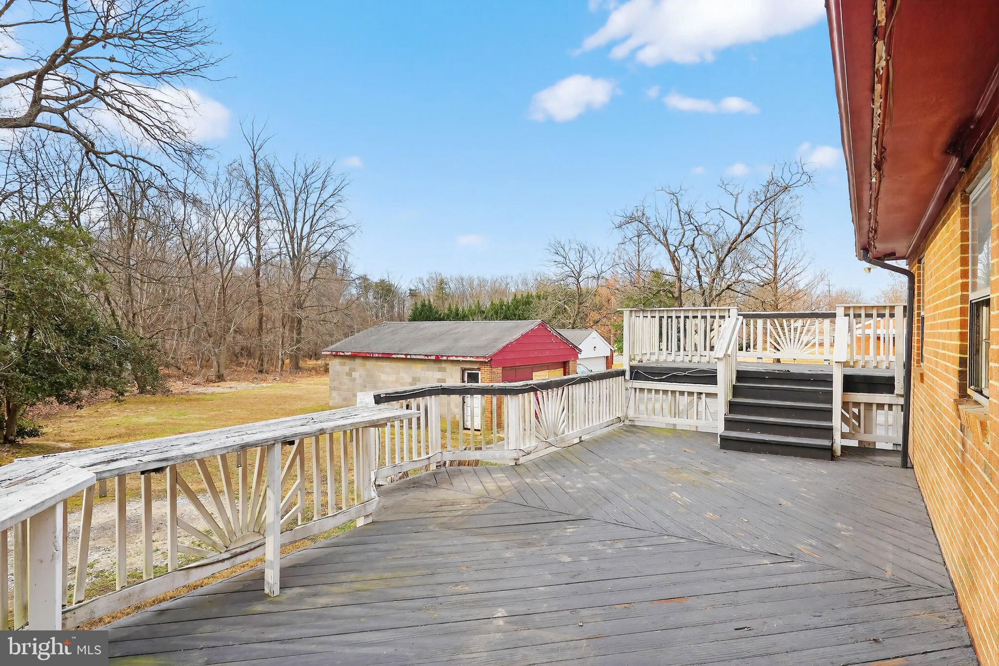 9300 Allentown Road Fort Washington, MD 20744 - Photo 29 of 33 a view of a balcony with wooden floor and fence