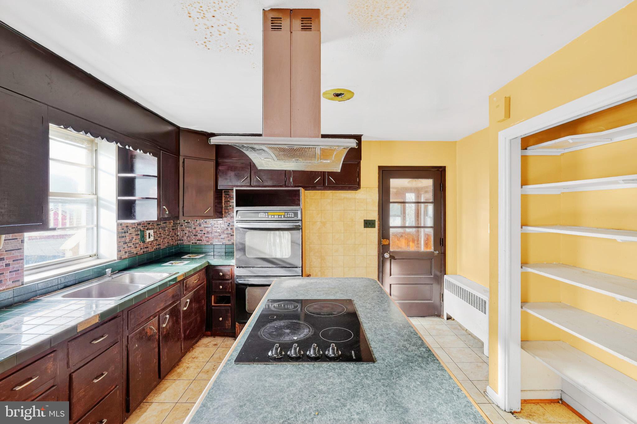 9300 Allentown Road Fort Washington, MD 20744 - Photo 3 of 33 a large kitchen with stainless steel appliances granite countertop a stove and a sink
