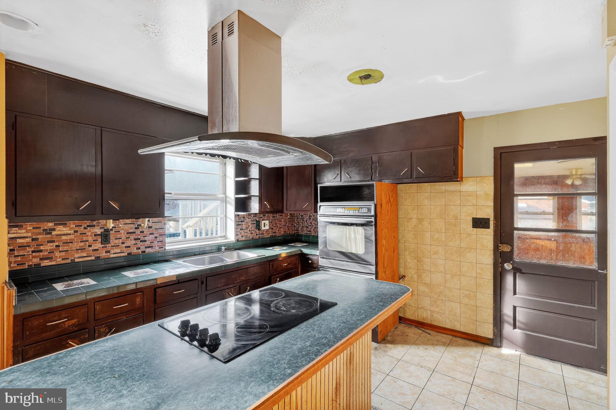 9300 Allentown Road Fort Washington, MD 20744 - Photo 5 of 33 a kitchen with stainless steel appliances granite countertop a sink and a stove