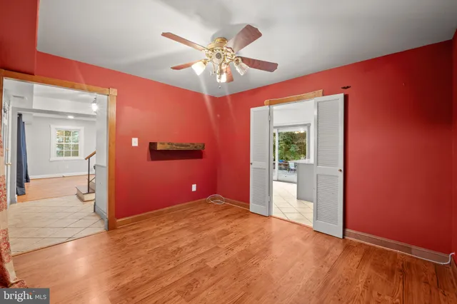 a view of entryway and hall with wooden floor