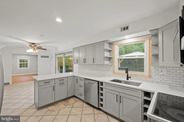 a bedroom with a large bed and a flat screen tv