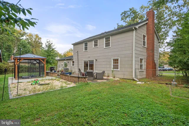 a view of a house with backyard and a slide