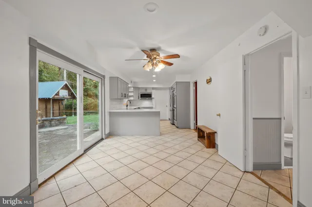 a view of a livingroom with a sofa and a yard