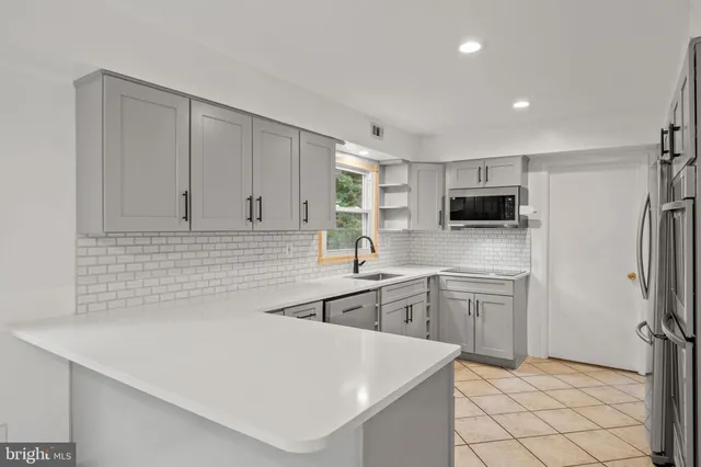 a view of an empty room and window chandelier fan