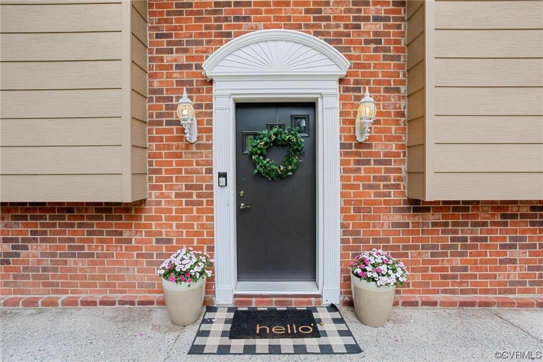 12912 Middlebrook Road Chester, VA 23831 - Photo 2 of 43 a front view of a house with a potted plant