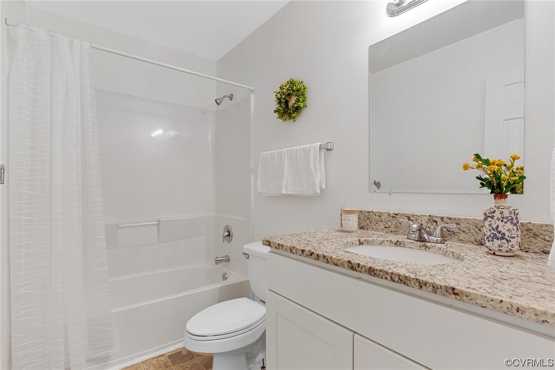 12912 Middlebrook Road Chester, VA 23831 - Photo 24 of 43 a bathroom with a granite countertop sink a toilet and shower