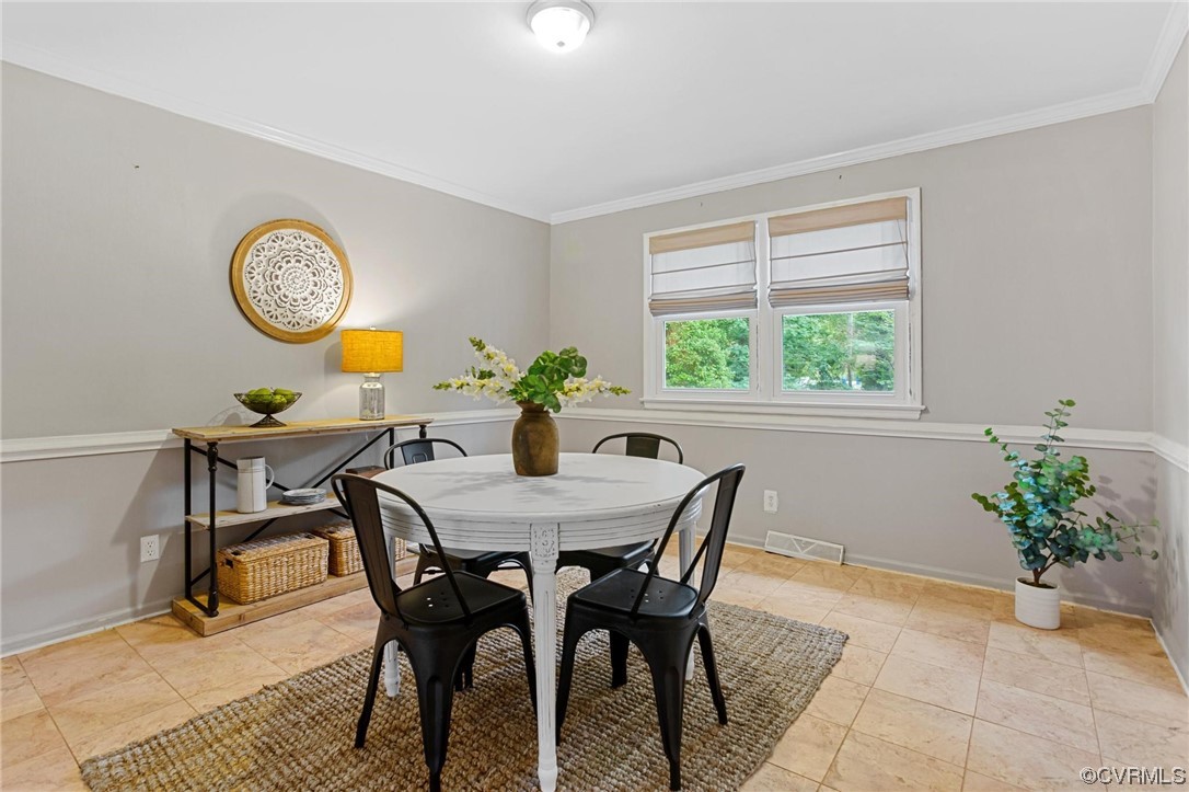 12912 Middlebrook Road Chester, VA 23831 - Photo 9 of 43 a view of a dining room with furniture and a table
