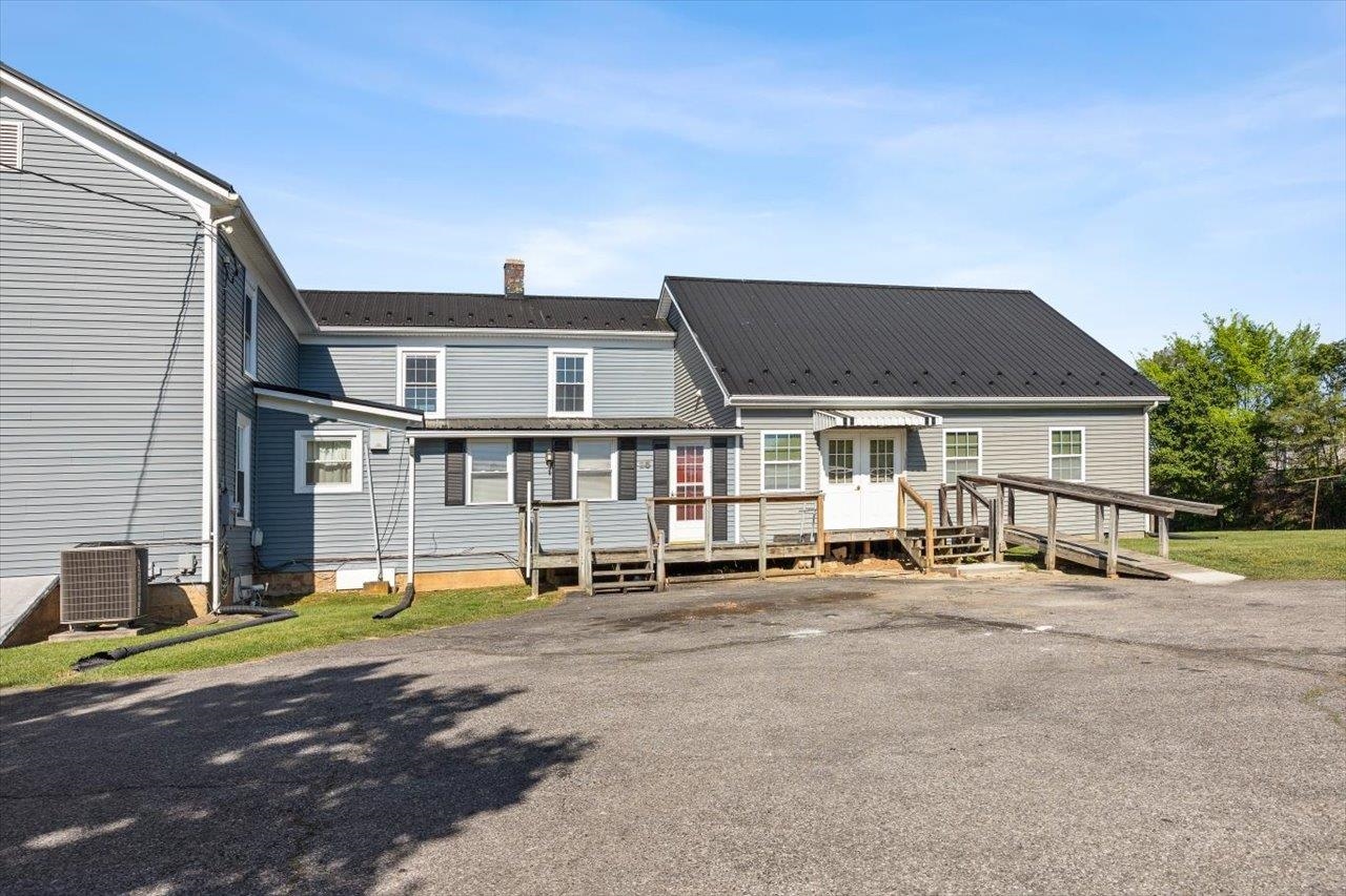 35 Tinkling Spring Road Fishersville, VA 22939 - Photo 11 of 39 a view of a house with a patio and a yard