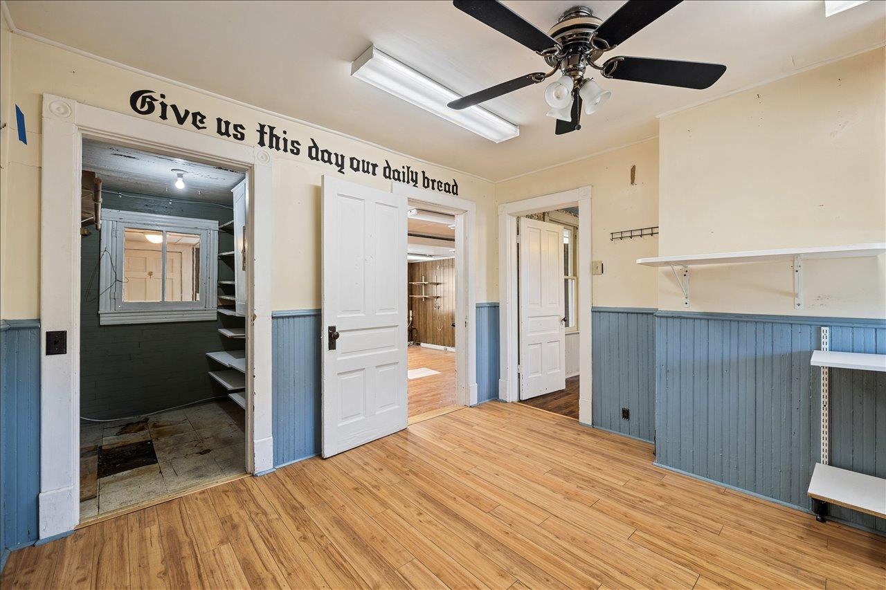 35 Tinkling Spring Road Fishersville, VA 22939 - Photo 14 of 39 a bedroom with a bed and a chandelier