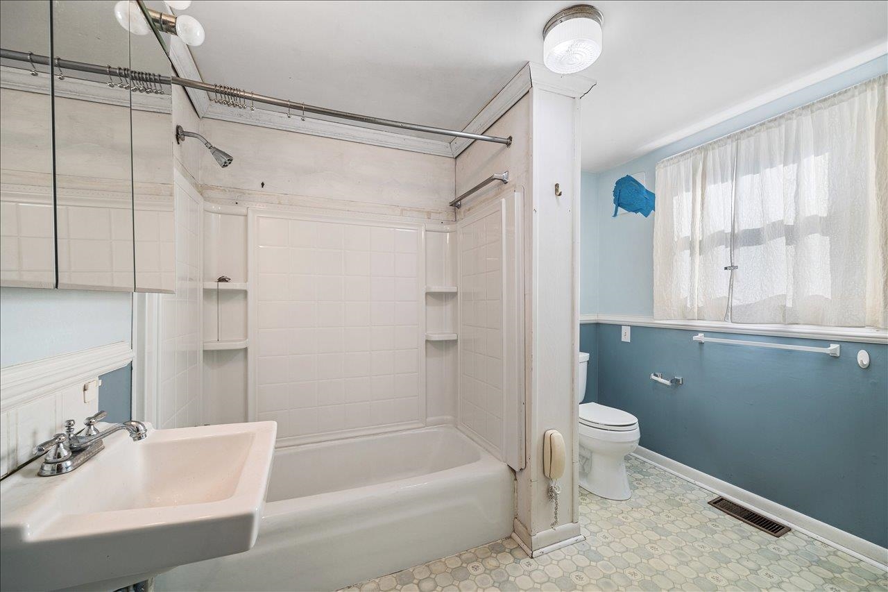 35 Tinkling Spring Road Fishersville, VA 22939 - Photo 23 of 39 a bathroom with a granite countertop sink a toilet and shower