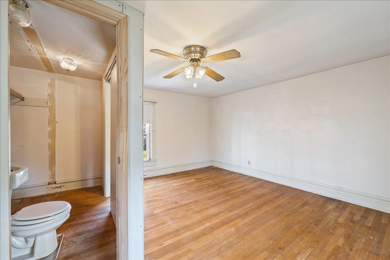 35 Tinkling Spring Road Fishersville, VA 22939 - Photo 29 of 39 a view of a room with a chandelier fan and wooden floor