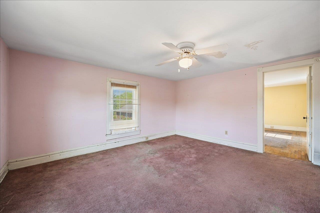 35 Tinkling Spring Road Fishersville, VA 22939 - Photo 31 of 39 an empty room with a window and a ceiling fan