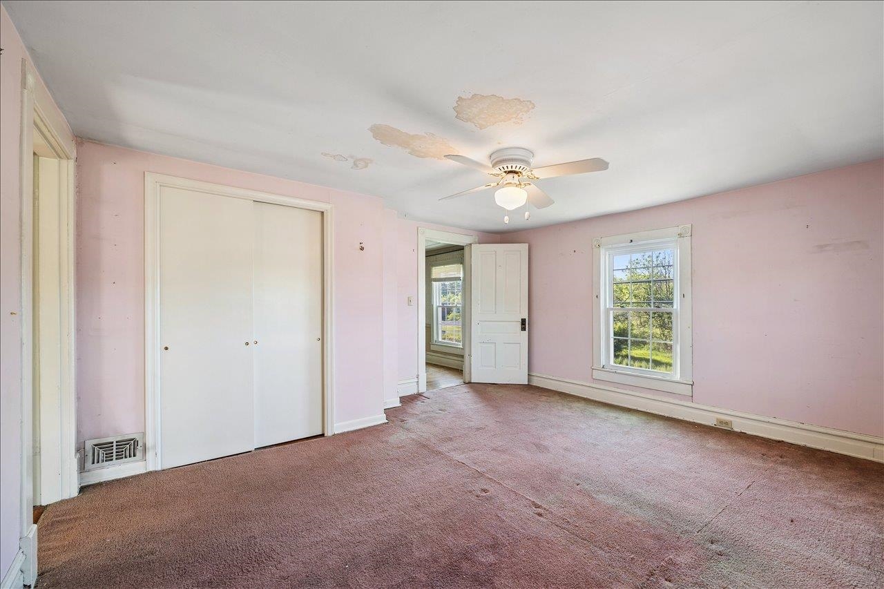 35 Tinkling Spring Road Fishersville, VA 22939 - Photo 32 of 39 an empty room with windows and fan