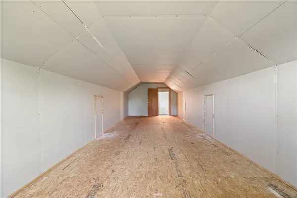a view of empty room with windows