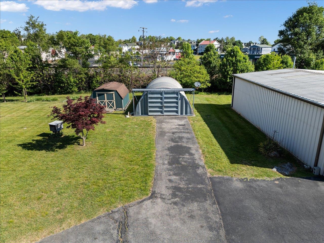 35 Tinkling Spring Road Fishersville, VA 22939 - Photo 9 of 39 a view of a garden with a building in the background