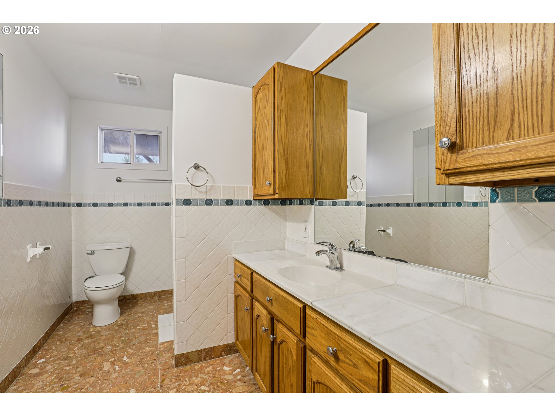 1005 Northeast 72nd Avenue Portland, OR 97213 - Photo 14 of 41 a bathroom with a sink a toilet and a mirror