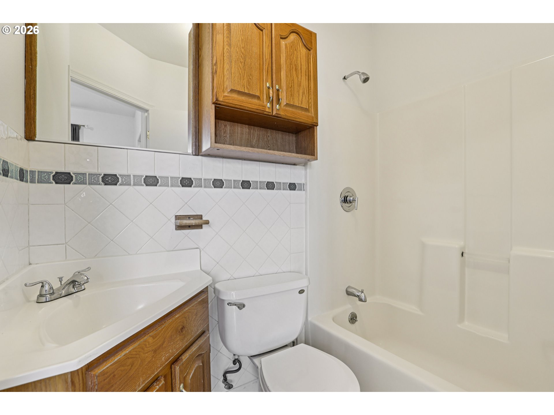 1005 Northeast 72nd Avenue Portland, OR 97213 - Photo 17 of 41 a bathroom with a sink a toilet and bathtub