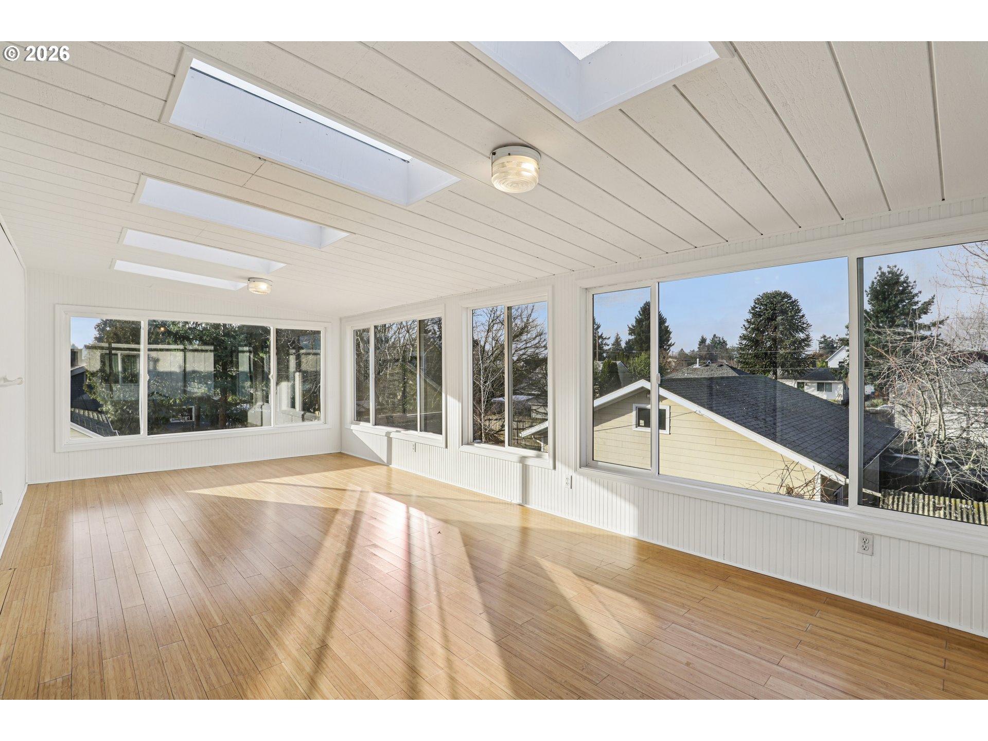 1005 Northeast 72nd Avenue Portland, OR 97213 - Photo 25 of 41 a view of an empty room with wooden floor and a window