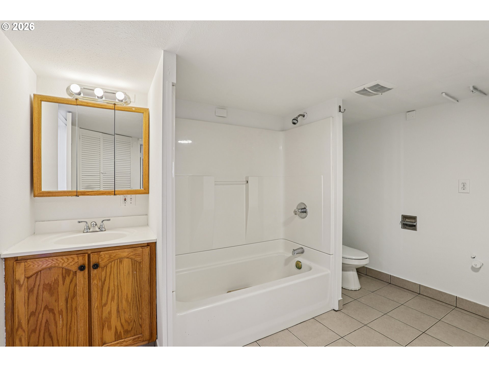 1005 Northeast 72nd Avenue Portland, OR 97213 - Photo 35 of 41 a bathroom with a bathtub a sink and a shower