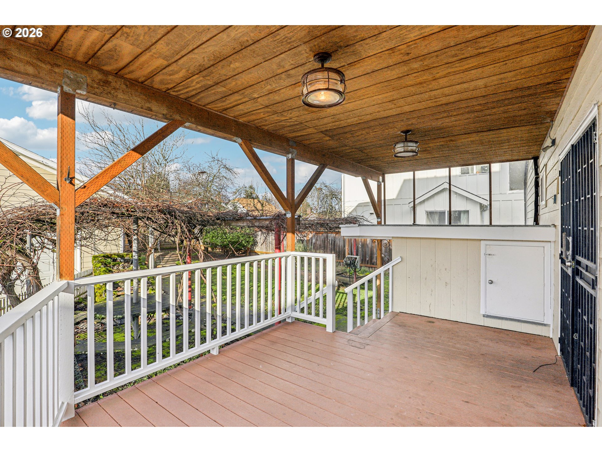 1005 Northeast 72nd Avenue Portland, OR 97213 - Photo 37 of 41 a view of a porch with wooden floor and iron stairs