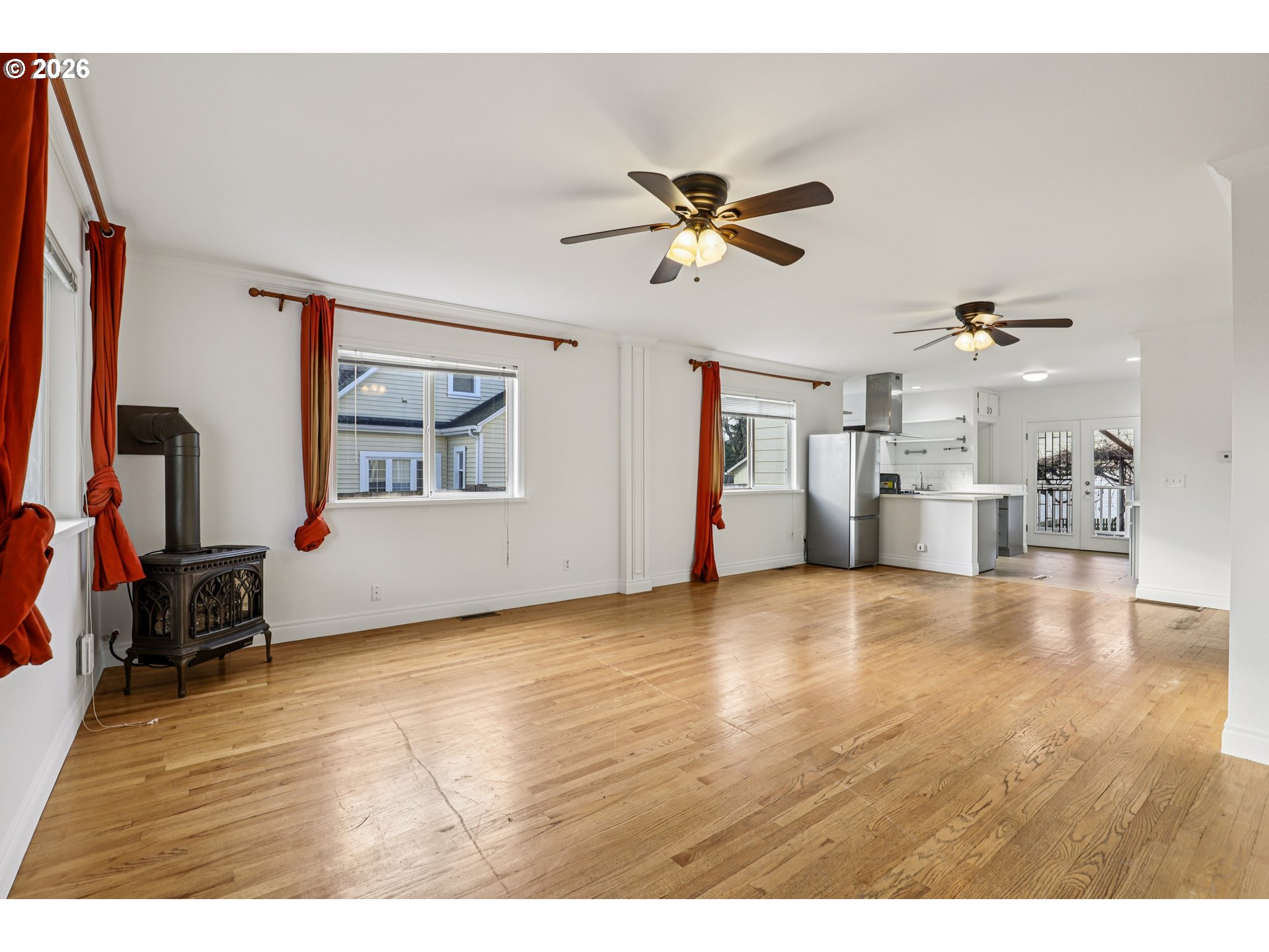 1005 Northeast 72nd Avenue Portland, OR 97213 - Photo 6 of 41 a view of empty room with wooden floor and windows