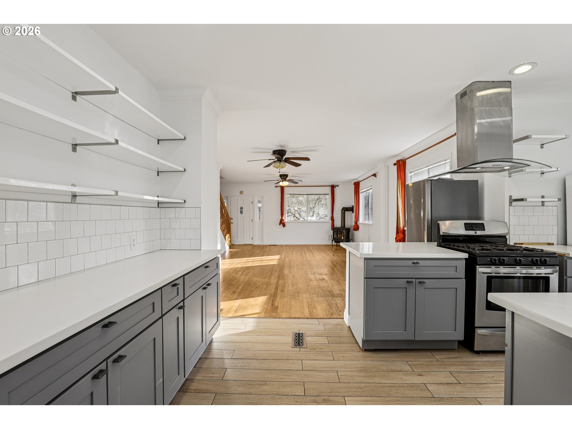 1005 Northeast 72nd Avenue Portland, OR 97213 - Photo 7 of 41 a kitchen with cabinets and wooden floor