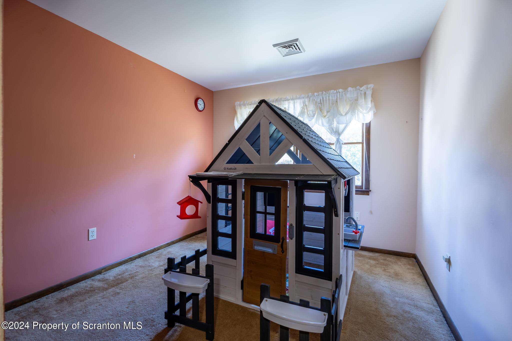 908 Violet Terrace Clarks Summit, PA 18411 - Photo 15 of 47 a view of staircase with wooden floor and a window
