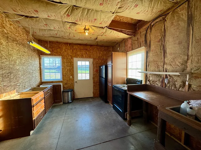 a kitchen with stainless steel appliances granite countertop a sink and a stove