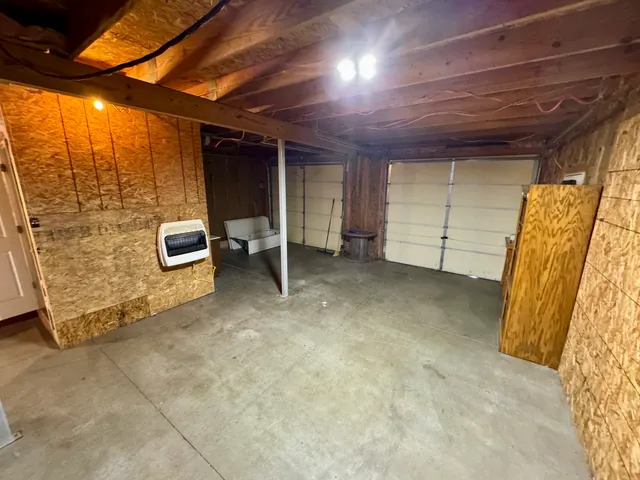 a view of a room with wooden walls