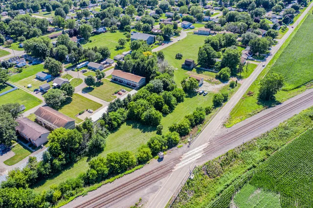 an aerial view of residential house with outdoor space and swimming pool