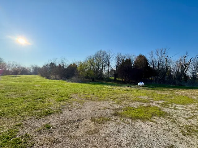 a view of an ocean and yard
