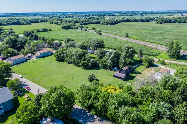 a view of a garden with a building in the background