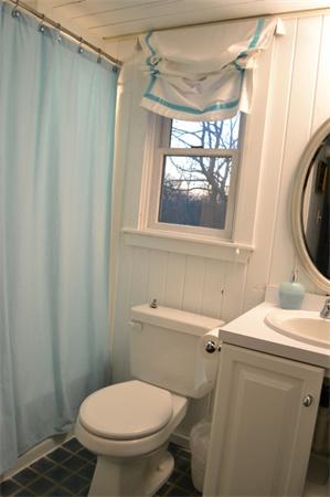 95 Litchfield Road Edgartown, MA 02539 - Photo 11 of 20 a bathroom with a toilet a sink and a mirror