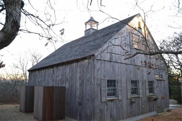 95 Litchfield Road Edgartown, MA 02539 - Photo 14 of 20 a front view of a house with trees