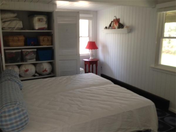 95 Litchfield Road Edgartown, MA 02539 - Photo 8 of 20 a bedroom with a bed and a window