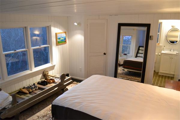 95 Litchfield Road Edgartown, MA 02539 - Photo 9 of 20 a bedroom with a bed and a dresser