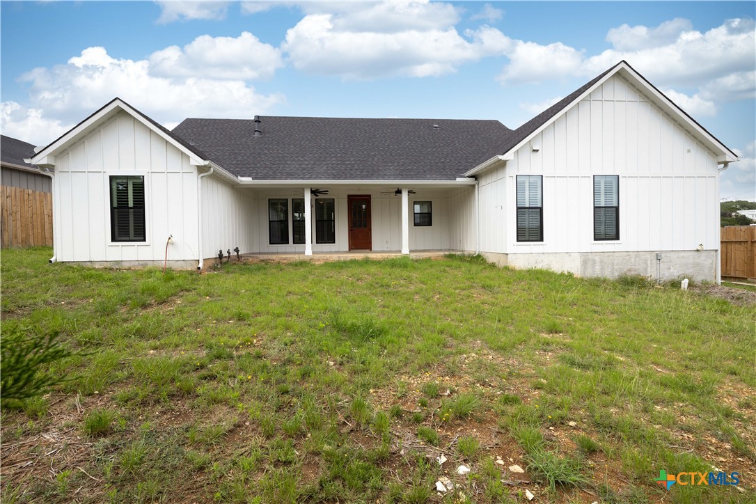 537 Compass Rose Spring Branch, TX 78070 - Photo 28 of 29 a view of a white house next to a yard with potted plants