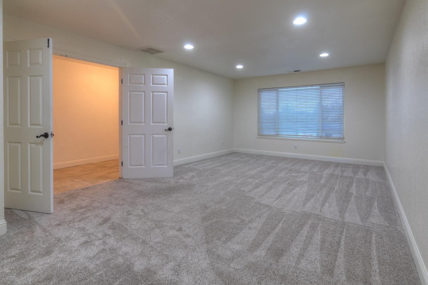 7535 Baldwin Street Valley Springs, CA 95252 - Photo 14 of 35 Large bonus room just of front entrance of the home.