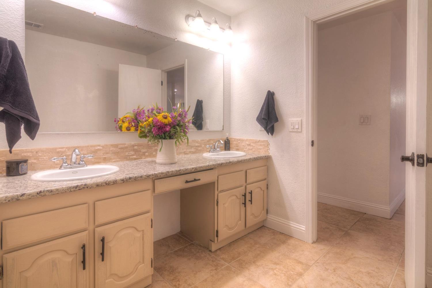 7535 Baldwin Street Valley Springs, CA 95252 - Photo 15 of 35 Hall bath with double sinks.