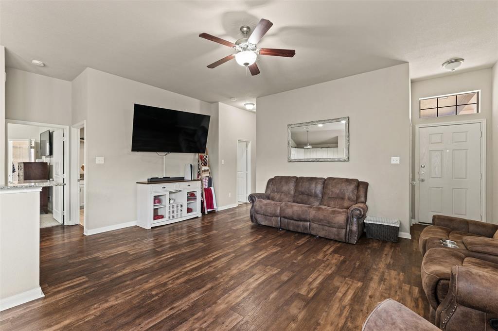 10313 Condor Loop Waco, TX 76708 - Photo 12 of 33 Wood-finish flooring throughout, ceiling fan with integrated lighting, and a front entry door with transom window