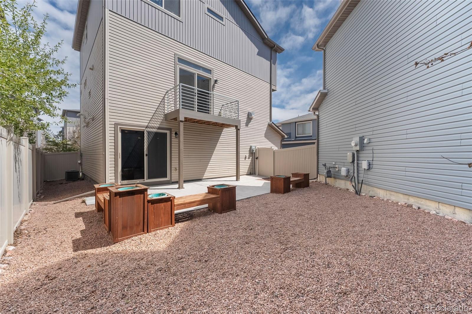 9528 Timberlake Loop Colorado Springs, CO 80927 - Photo 31 of 37 a view of a house with backyard and sitting area