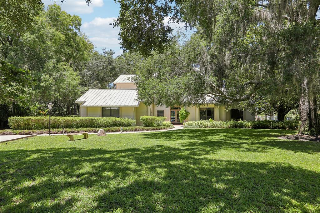 17810 Crawley Road Odessa, FL 33556 - Photo 62 of 76 a front view of a house with a yard and trees