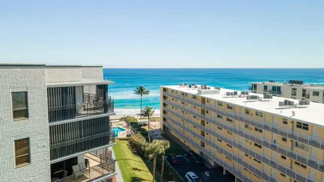 a view of a balcony with an outdoor seating
