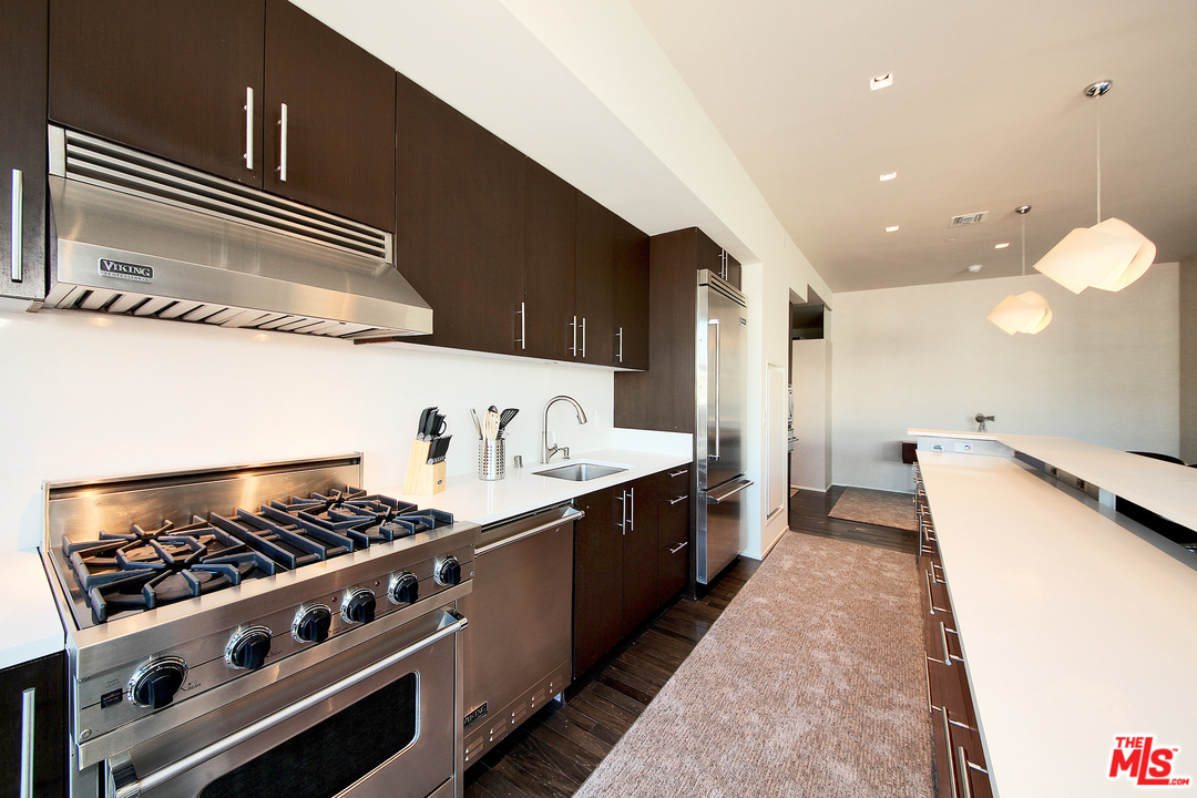 1645 Vine Street, Unit 908 Los Angeles, CA 90028 - Photo 19 of 52 a kitchen with stove and cabinets