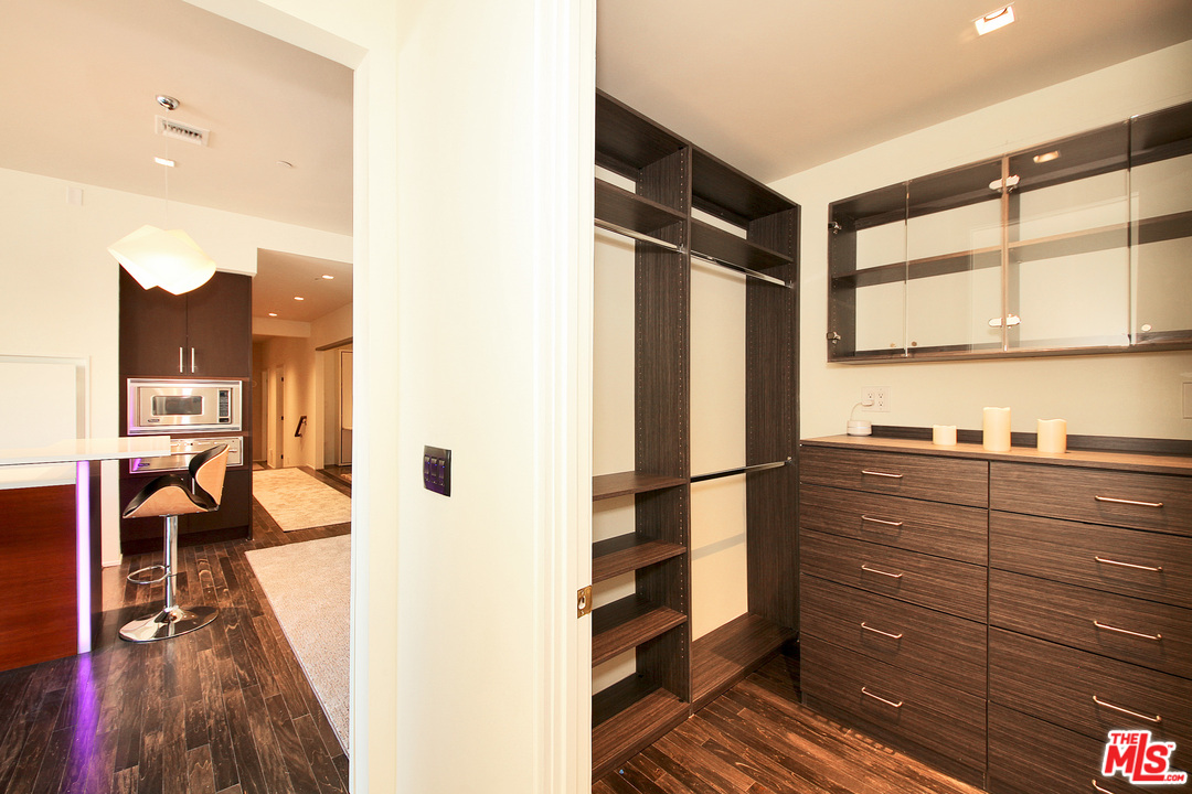 1645 Vine Street, Unit 908 Los Angeles, CA 90028 - Photo 21 of 52 a kitchen with a refrigerator and wooden floor