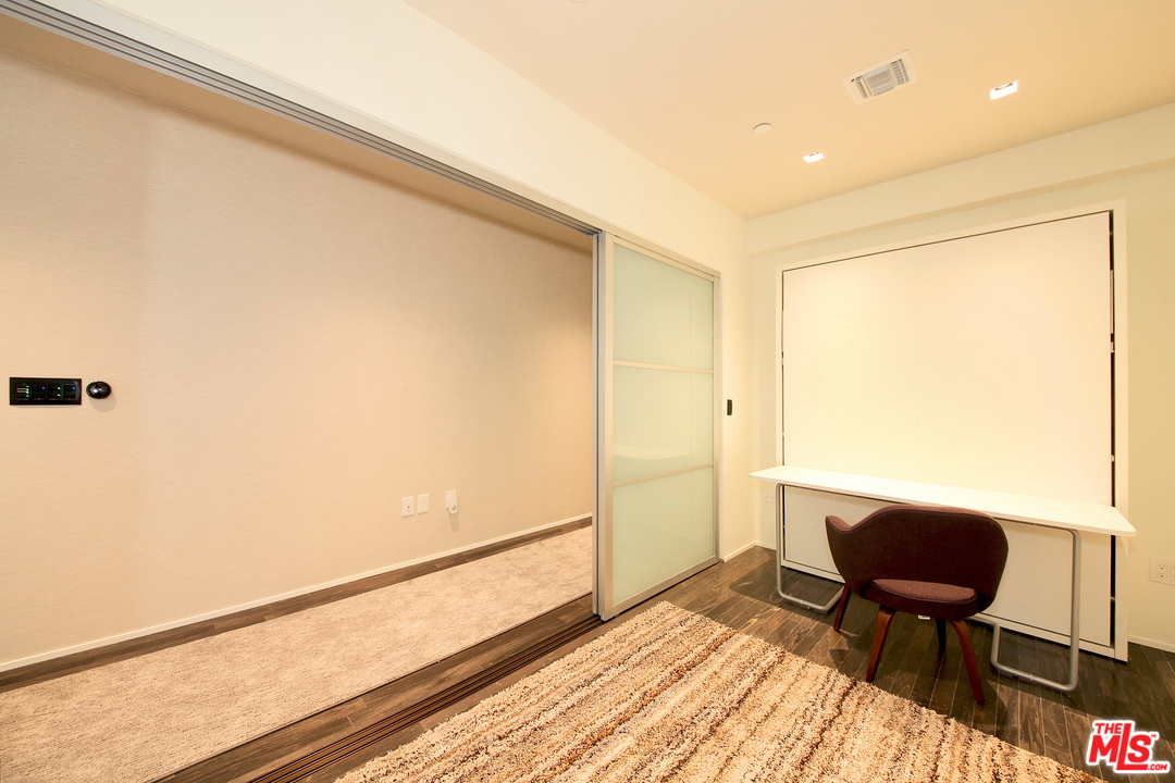 1645 Vine Street, Unit 908 Los Angeles, CA 90028 - Photo 28 of 52 a view of table and chair in room